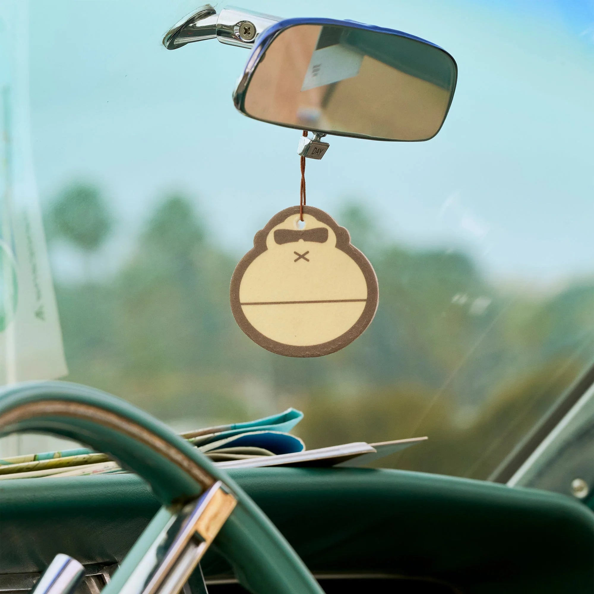 Air freshener hanging from a rearview mirror