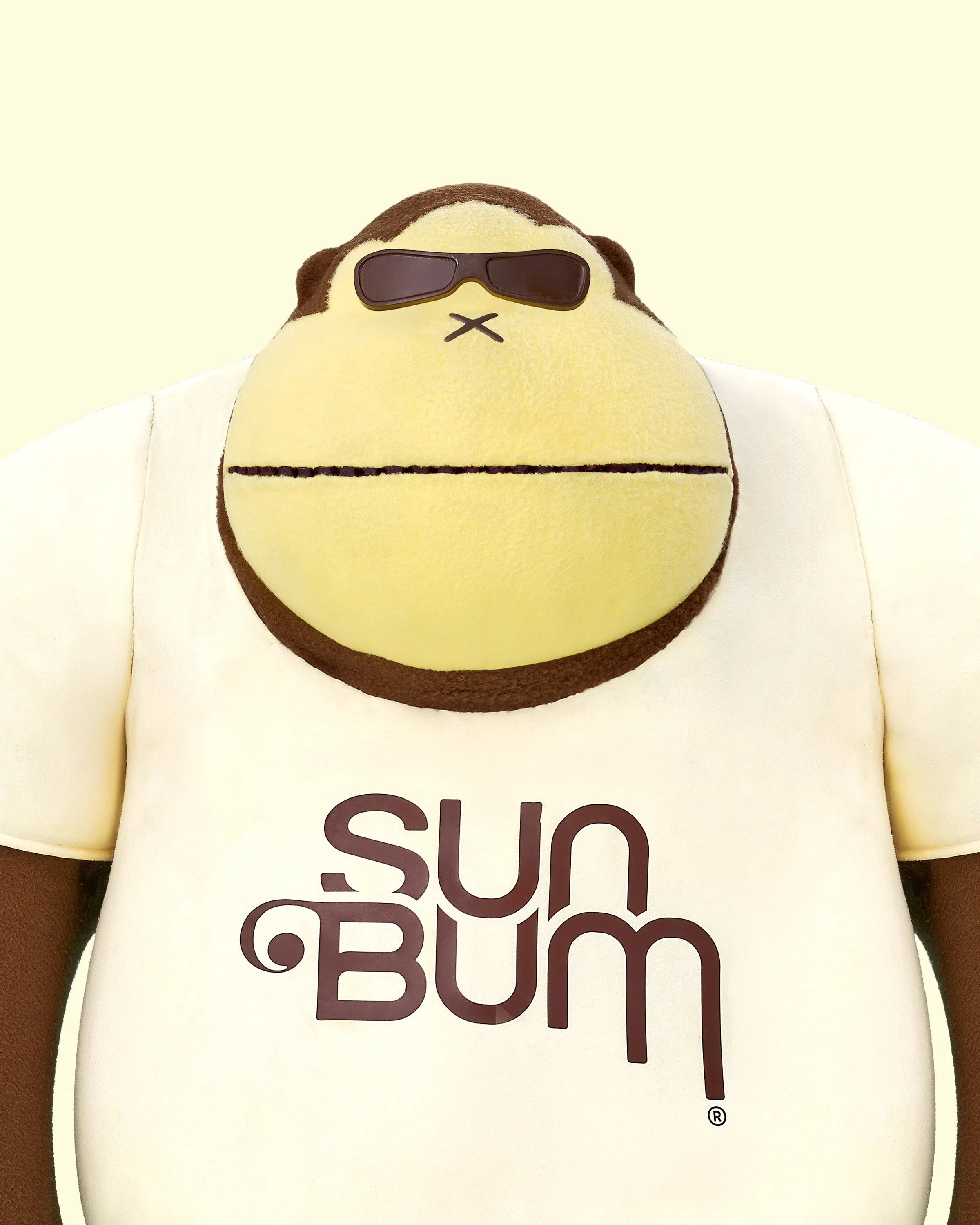 Sun Bum mascot Sonny wearing a Trust The Bum shirt