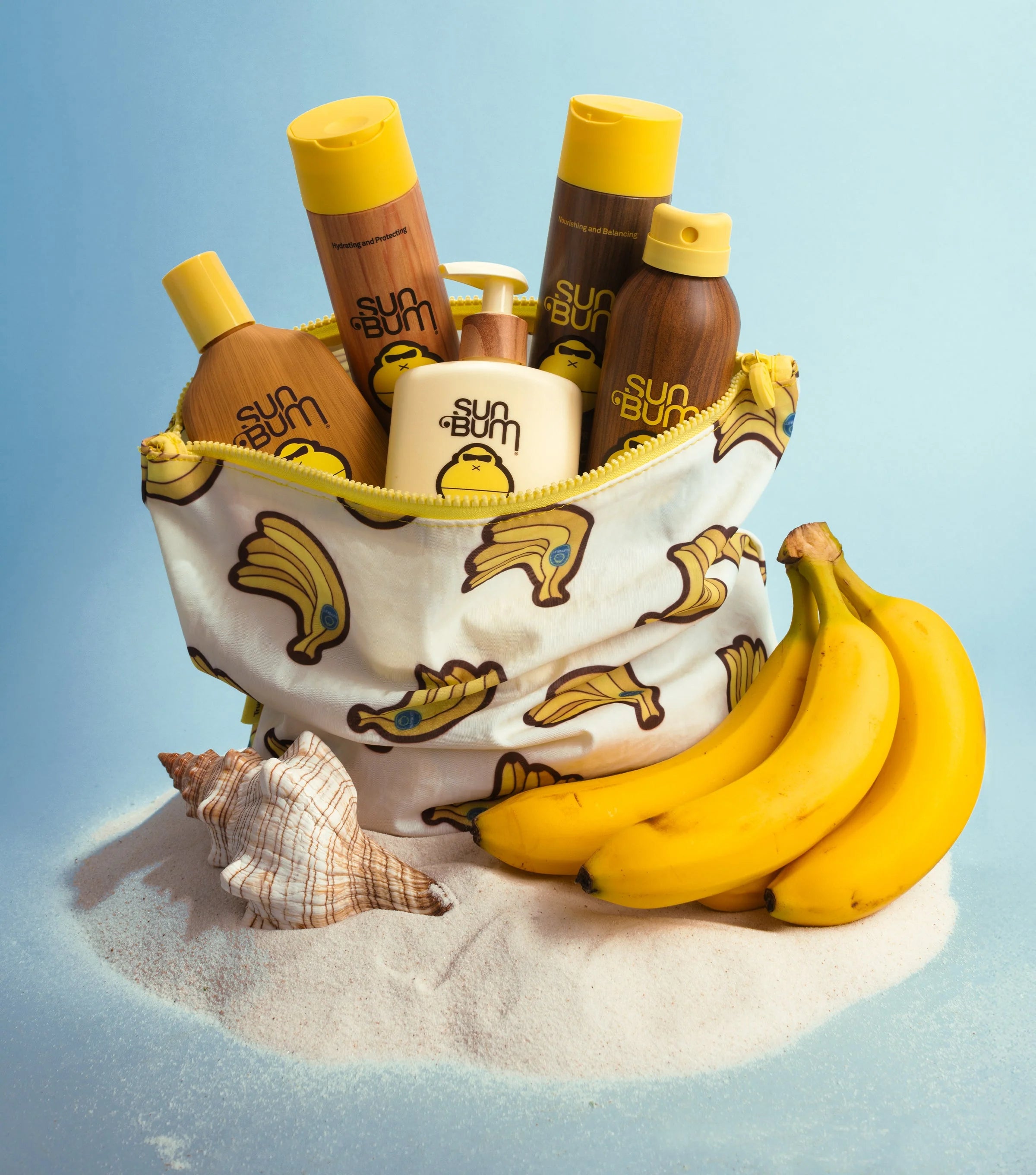 Sun Bum products in a beach bag on sand